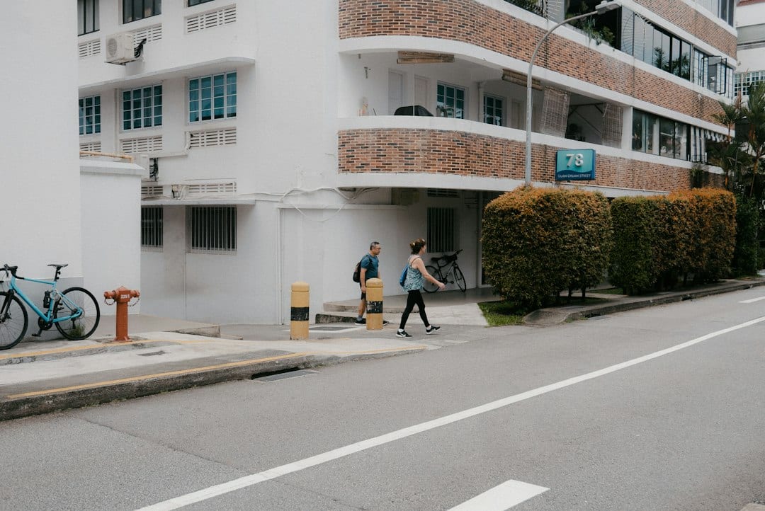 Couple walking near Singapore residential towers