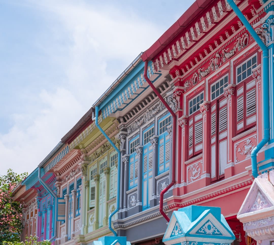 Red and white conserved shophouse exterior in Singapore