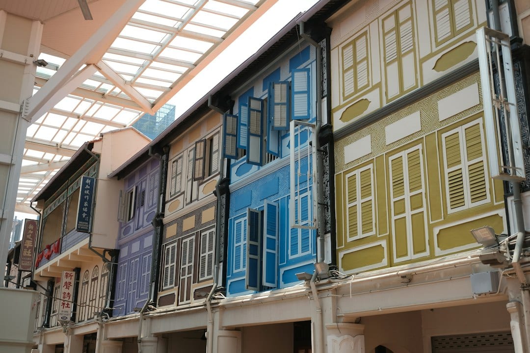 Colourful conserved shophouses along a quiet Singapore street